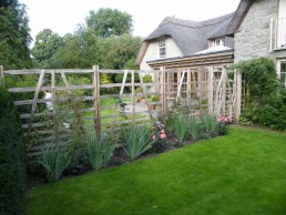 6 foot high sweet chestnut gate hurdles and gates after flower border is created
