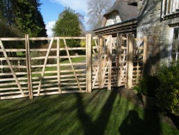 6 foot high sweet chestnut gate hurdles and gates before flower border is created