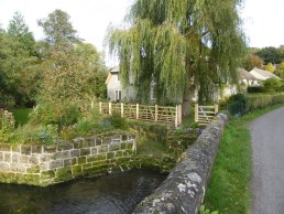 Sweet chestnut gate hurdles by mill stream
