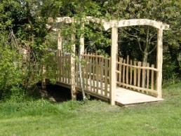 Oak bridge with chestnut paling sides