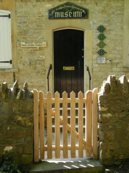 Planed oak picket gate outside Castle Combe Museum