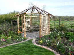 Sweet chestnut pergola with cleft trellis panels